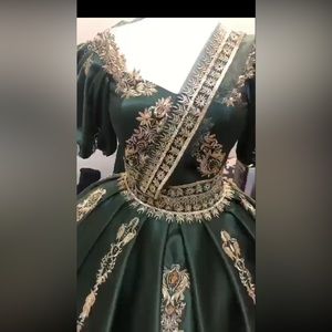 A two piece ballgown with a veil  and back corset